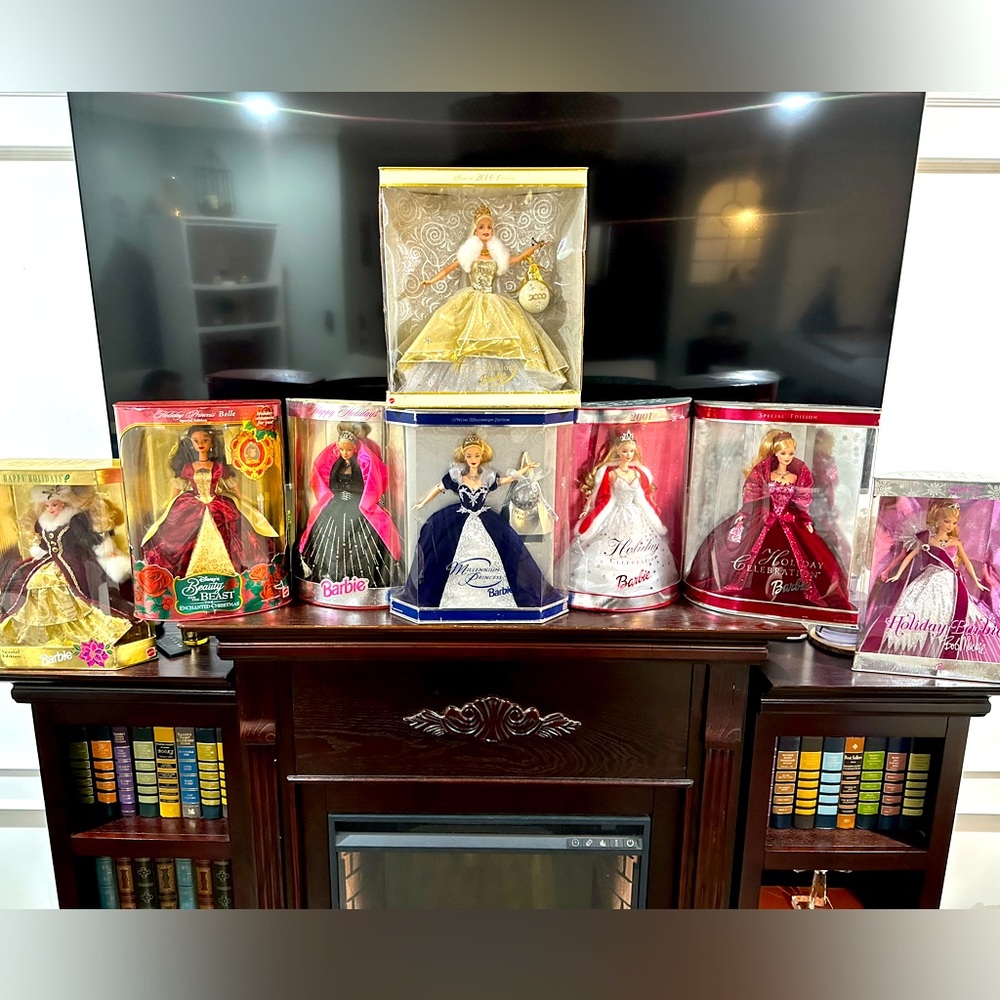 Collectible Barbies in cases. Some damage to boxes. Dolls never touched.